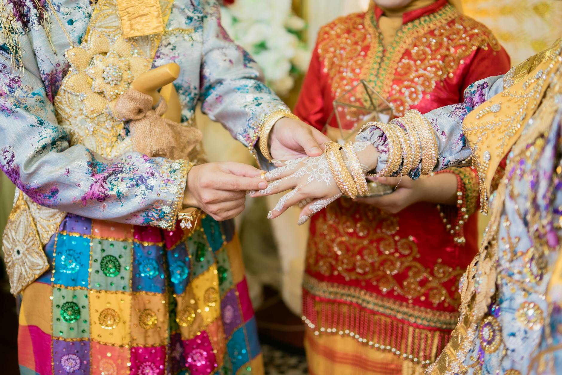 Colorful traditional attire highlights a vibrant wedding ceremony in Kendari, Indonesia.