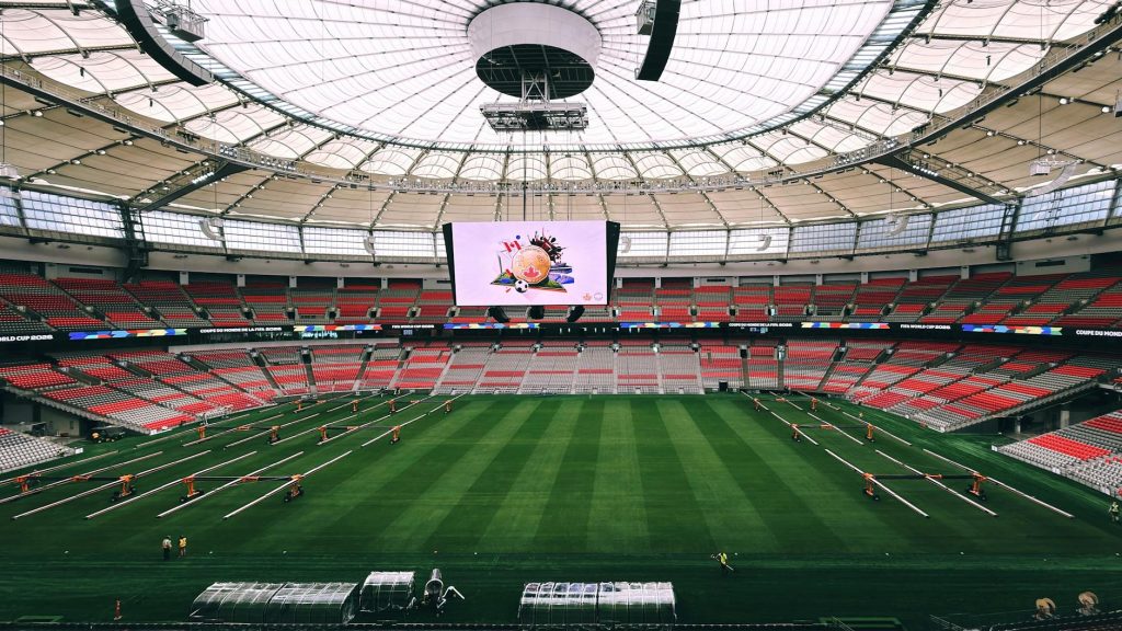 Interior view of BC Place Stadium in Vancouver, showcasing its vast seating and advanced roof structure.