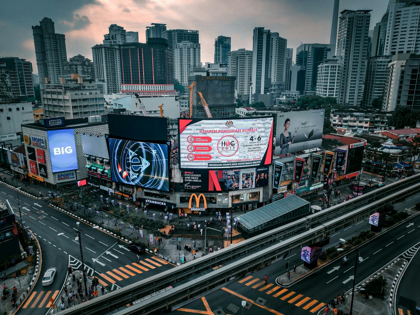 Dynamic city skyline with skyscrapers and busy streets at dusk creating an urban cityscape.