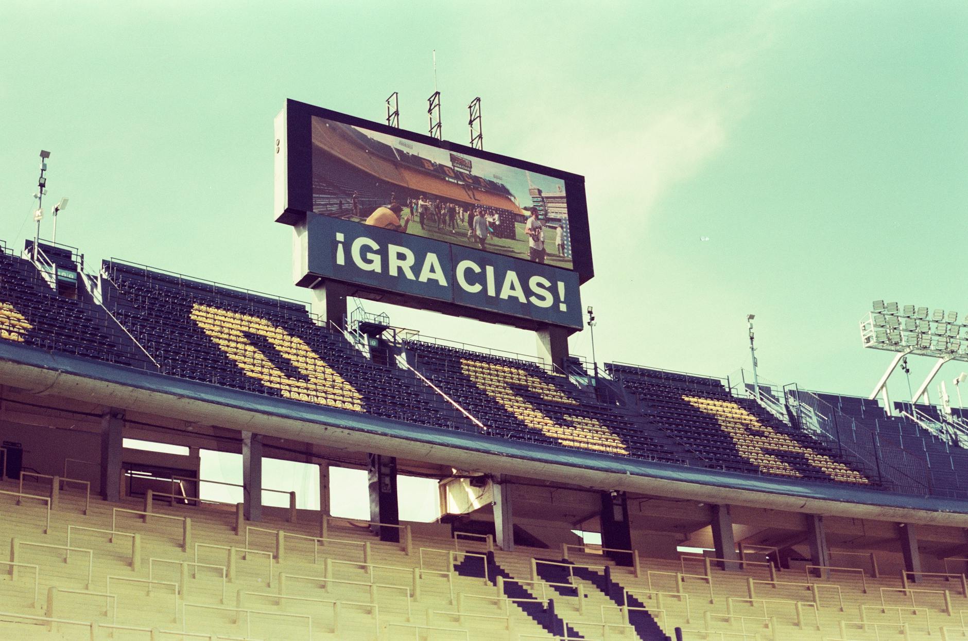 Empty La Bombonera stadium in Buenos Aires featuring a thank you message on the screen.