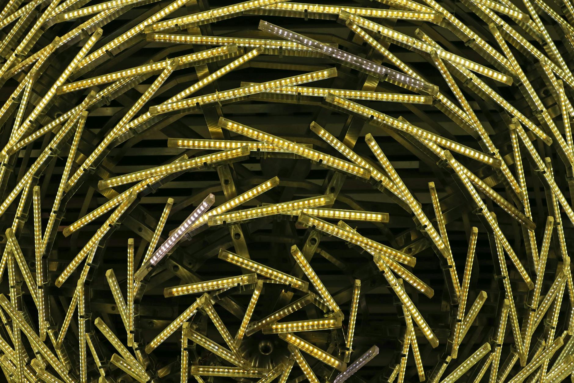 Close-up of a swirling pattern created by multiple LED lights in an abstract arrangement.