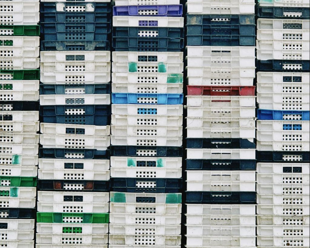Colorful rows of plastic crates stacked neatly in Konaev, Almaty Region.