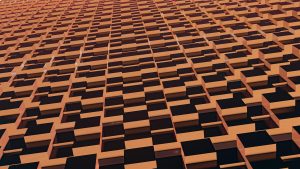 A mesmerizing pattern of golden cubes creating an abstract geometric design, ideal for modern wallpapers.