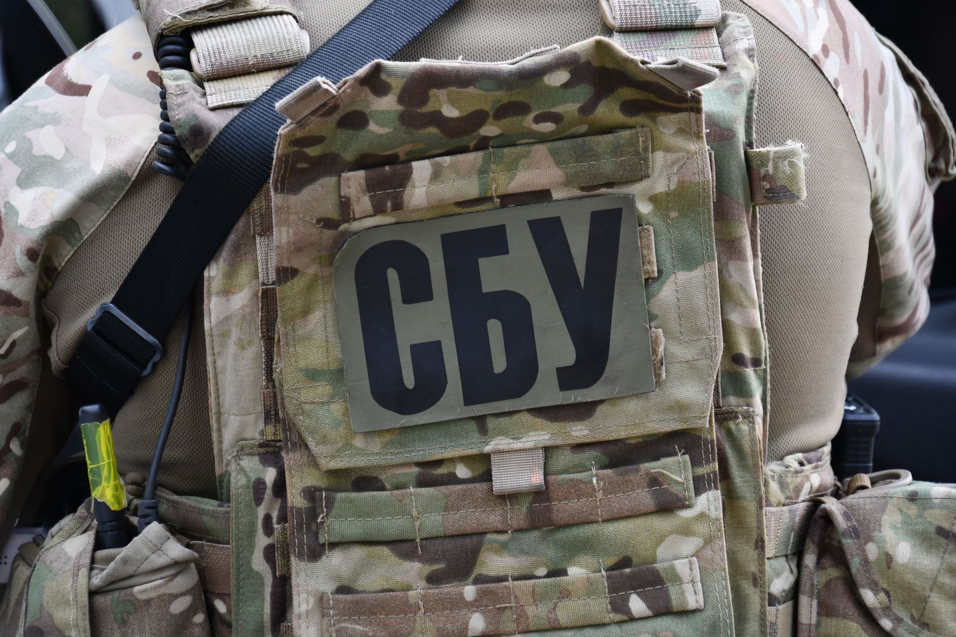 Close-up of a soldier wearing a camouflage vest with the Security Service of Ukraine insignia in Kyiv.
